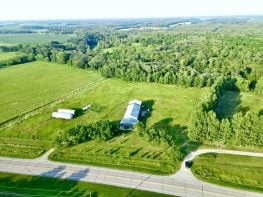 7.9 acre Cannabis Approvable Farmstead with 2000sf 3b/2ba and 2000sf attached shop with 14′ high ceilings, insulated heat/AC and 1000sf covered pad